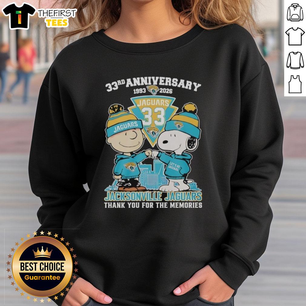 Top Jacksonville Jaguars outfit featuring Snoopy and Charlie Brown 33rd Anniversary sweatshirt 1993-2026.
