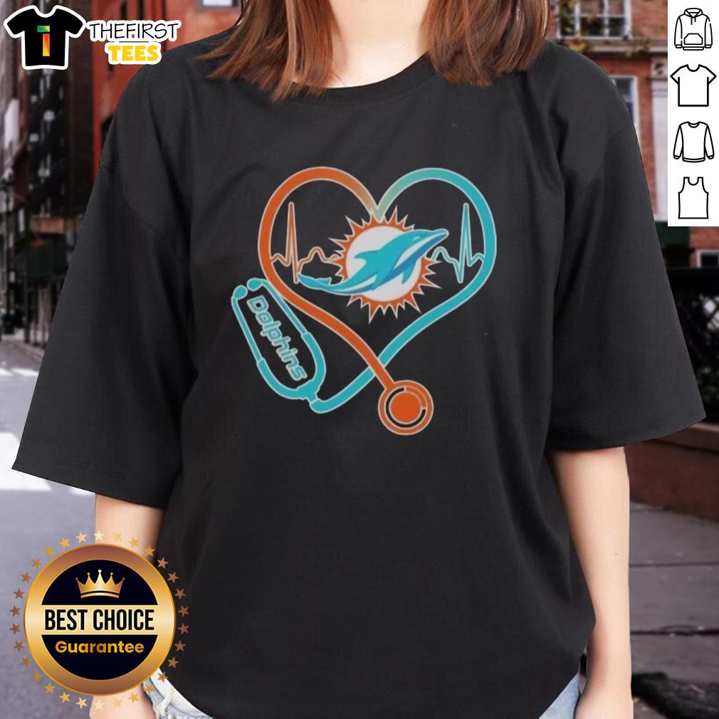 Alt Text: Ladies' Miami Dolphins Tee featuring stethoscope and headphones, perfect for passionate fans.