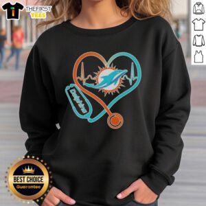 Miami Dolphins sweatshirt featuring stethoscope headphones, perfect for fans showcasing team spirit and style.