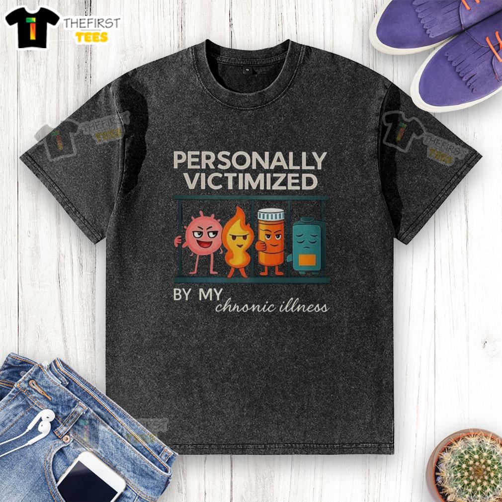 Top Personally Victimized By My Chronic Illness washed t-shirt displayed on a hanger, showcasing its soft fabric and bold print.