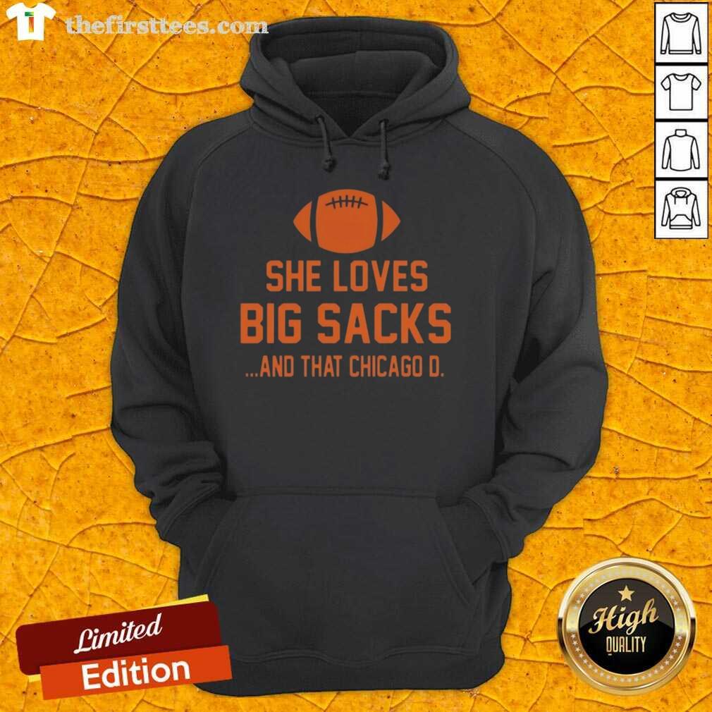 Woman wearing a Chicago D hoodie, showcasing her love for big sacks, posing confidently outdoors.