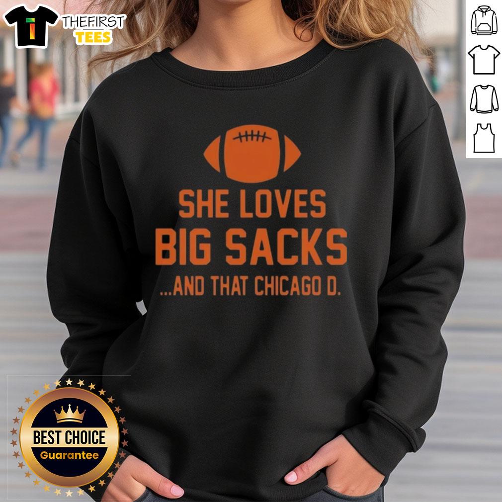Fashionable woman wearing a Chicago D sweatshirt, showcasing her love for big sacks in a trendy urban setting.