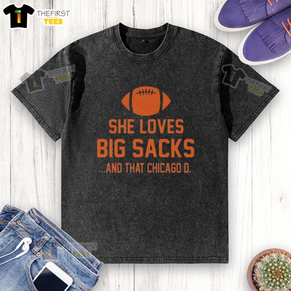Alt Text: Woman wearing a Chicago D washed t-shirt, showcasing her love for big sacks at a trendy urban location.