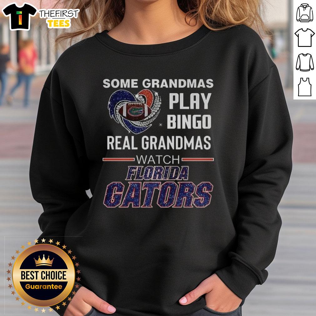Cozy Florida Gators sweatshirt featuring 'Real Grandmas Watch' design, perfect for game day and bingo lovers.
