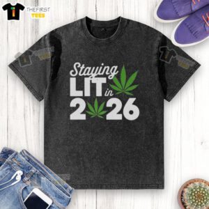 Top Staying Lit in 2026 Marijuana Meme on a Washed T-Shirt featuring a vibrant cannabis design and playful text.