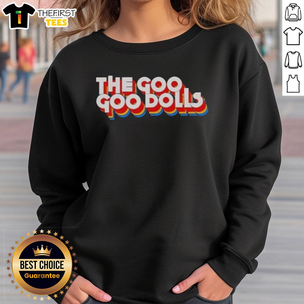 Alt Text: Neil Barrow wearing the Top The Diplomat Goo Sweatshirt, showcasing its unique design and stylish fit.