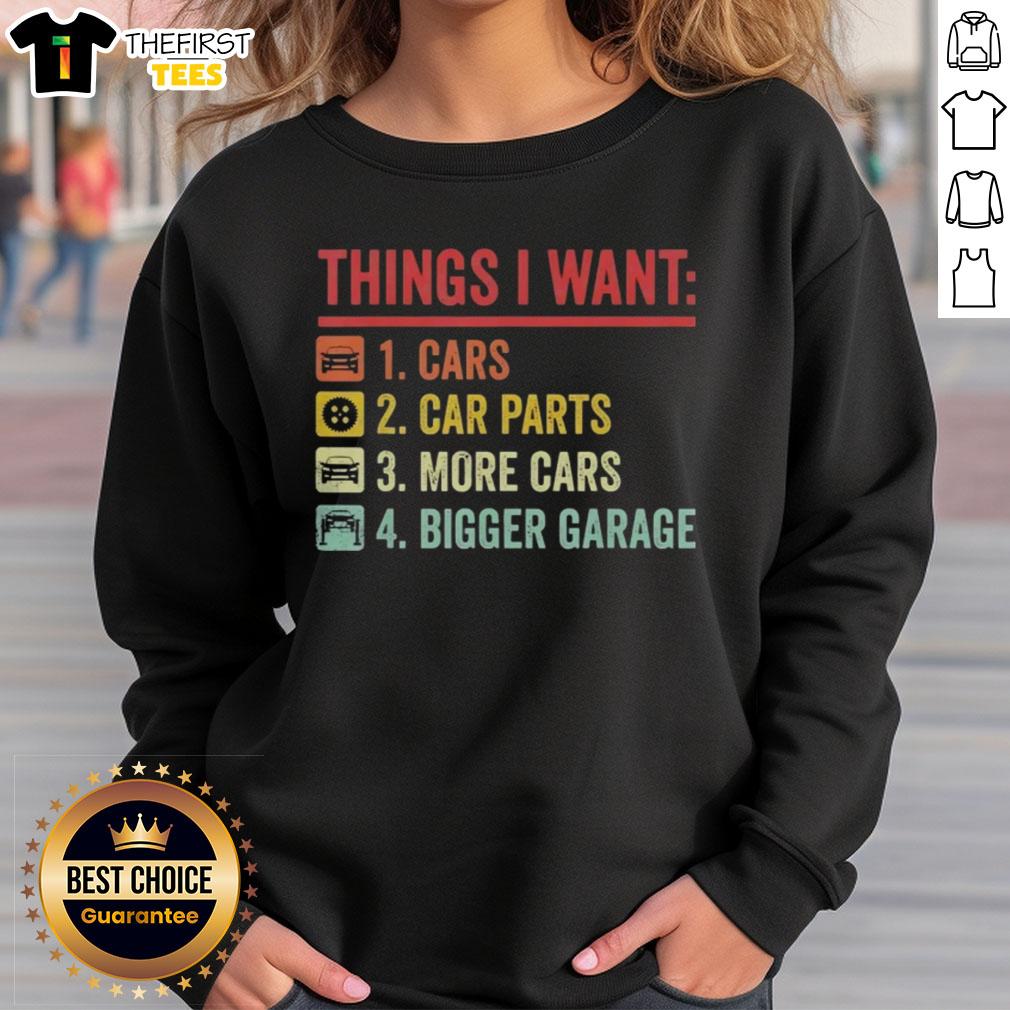 Cozy sweatshirt featuring 'Top Things I Want: Car Parts, More Cars, Bigger Garage,' perfect for car enthusiasts.