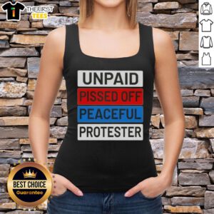 Unpaid peaceful protester wearing a tank top with 'Top Unpaid Pissed Off' slogan at a rally, showcasing activism.