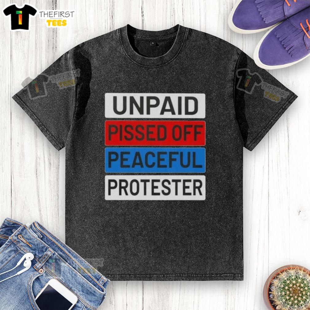 Top unpaid peaceful protester wearing a washed t-shirt, expressing frustration during a demonstration for social change.