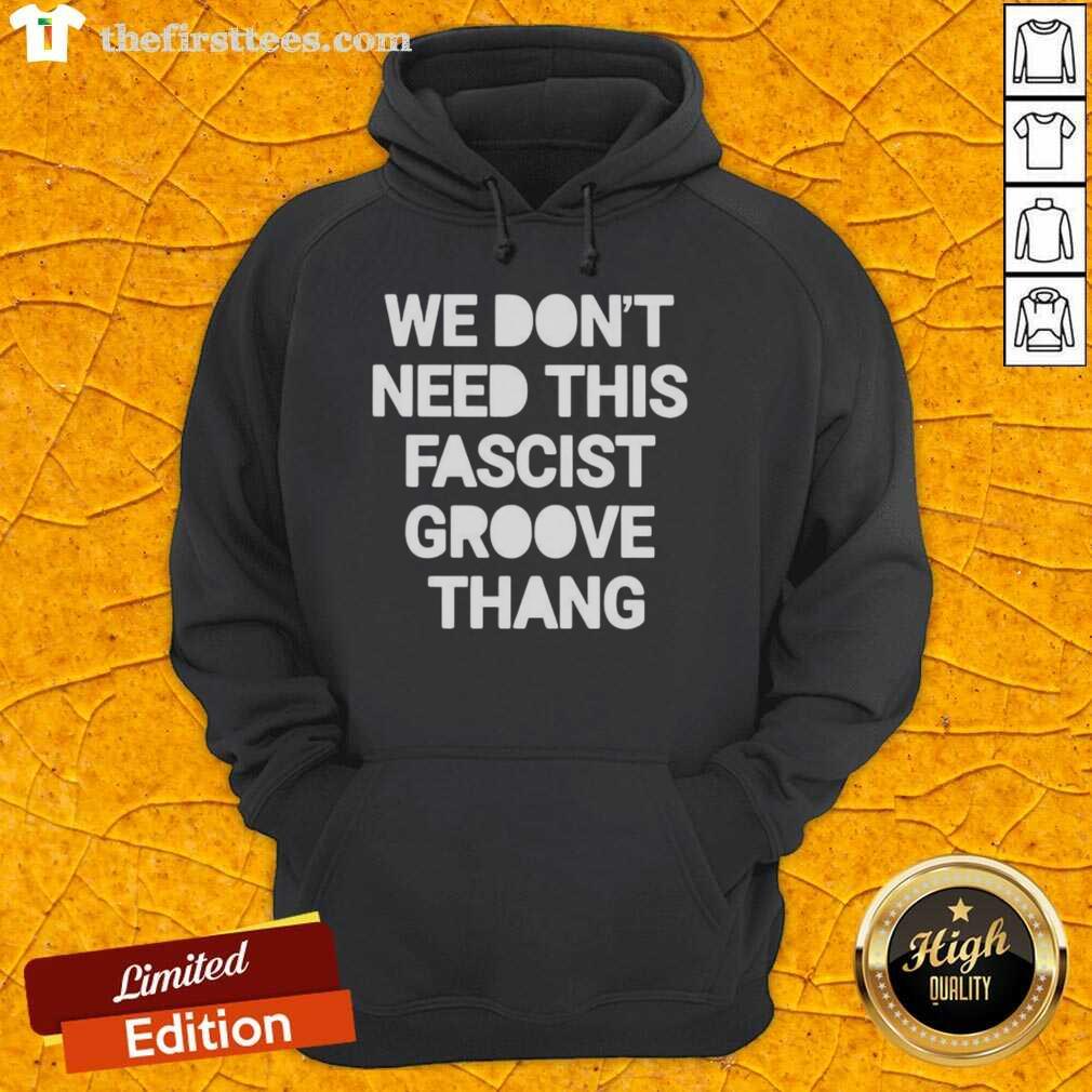 Alt Text: Top We Don't Need This Fascist Groove Thang hoodie displayed on a mannequin, highlighting its unique design and message.