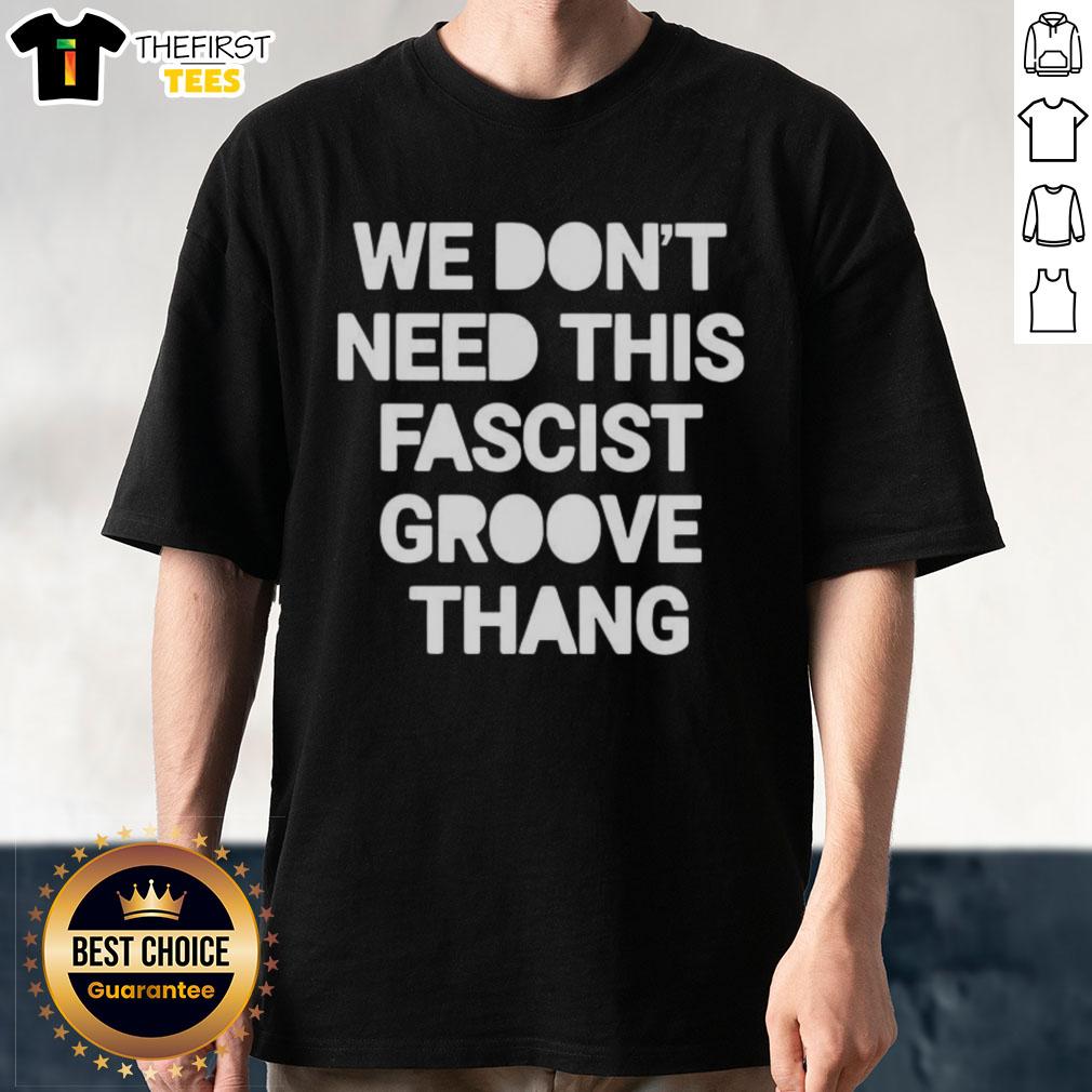Alt Text: Top We Don't Need This Fascist Groove Thang T-Shirt featuring bold graphic design and vibrant colors, perfect for statement wear.