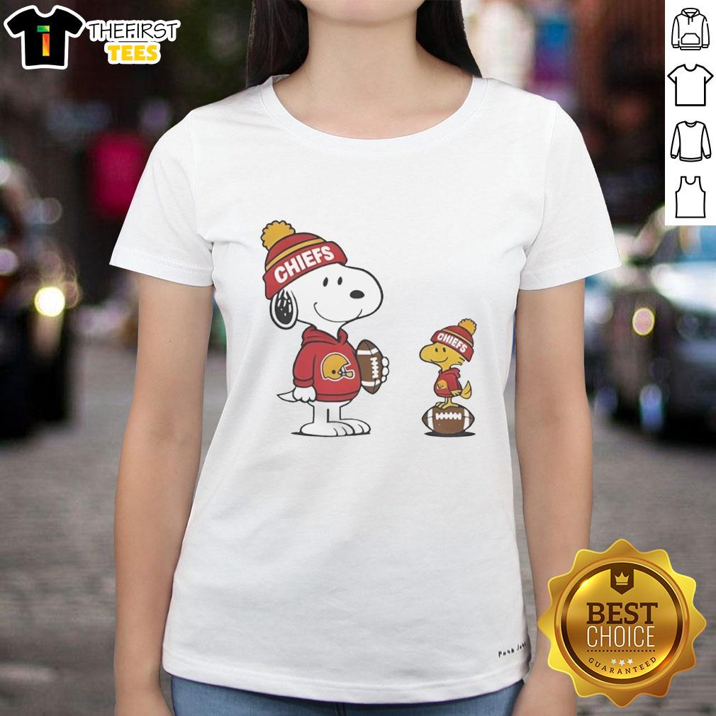 Alt Text: Cute Kansas City Chiefs Snoopy Woodstock football NFL ladies tee, perfect for fans of stylish team apparel.