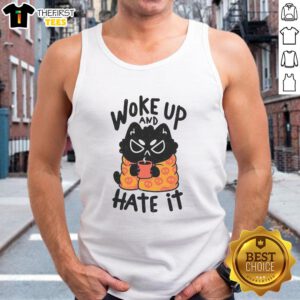 Funny cat wearing a tank top, looking grumpy after waking up, captures the essence of 'Funny Cat Woke Up And Hate It'.
