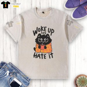 Funny cat waking up and looking grumpy on a washed T-shirt, perfect for humor lovers and cat enthusiasts.