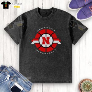 Alt Text: Classic circle logo of the Nebraska Cornhuskers basketball on a washed t-shirt, showcasing team spirit and style.