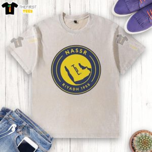 Alt Text: Official Al Nassr 1955 logo washed t-shirt featuring vintage design in vibrant colors, perfect for fans and collectors.