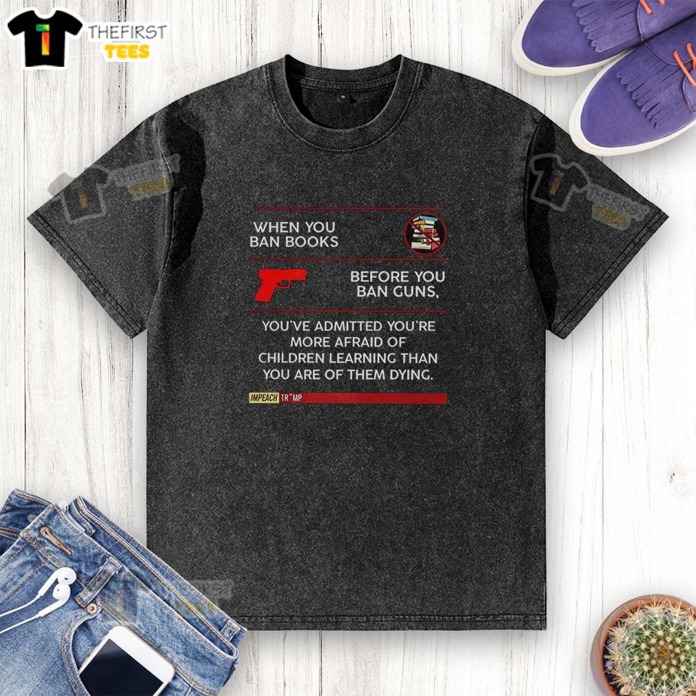 Official washed t-shirt with text: 'Ban books before guns? Afraid of kids learning more than dying.'