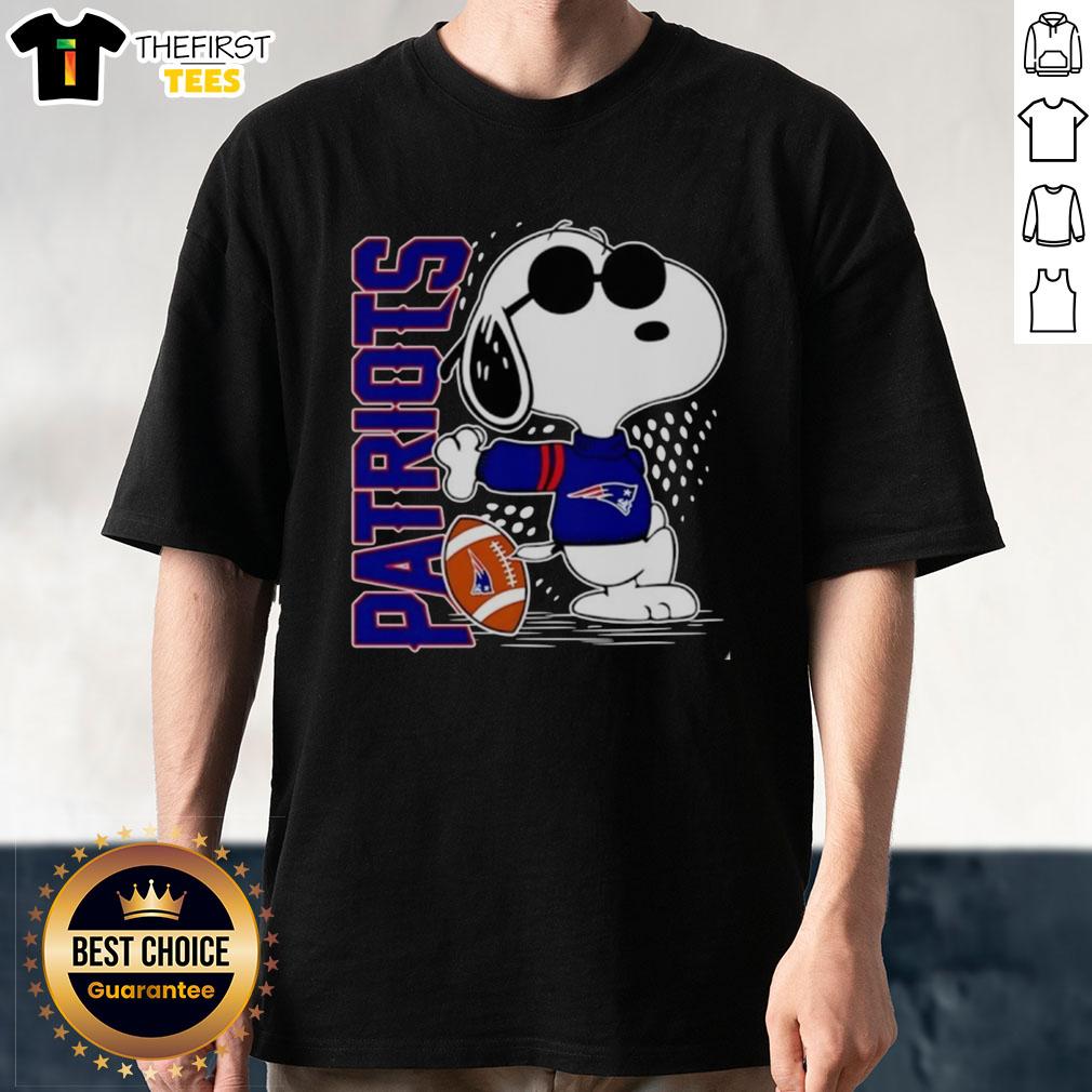 Alt Text: Original Peanuts Snoopy X New England Patriots football T-shirt featuring Snoopy in team colors and logo.