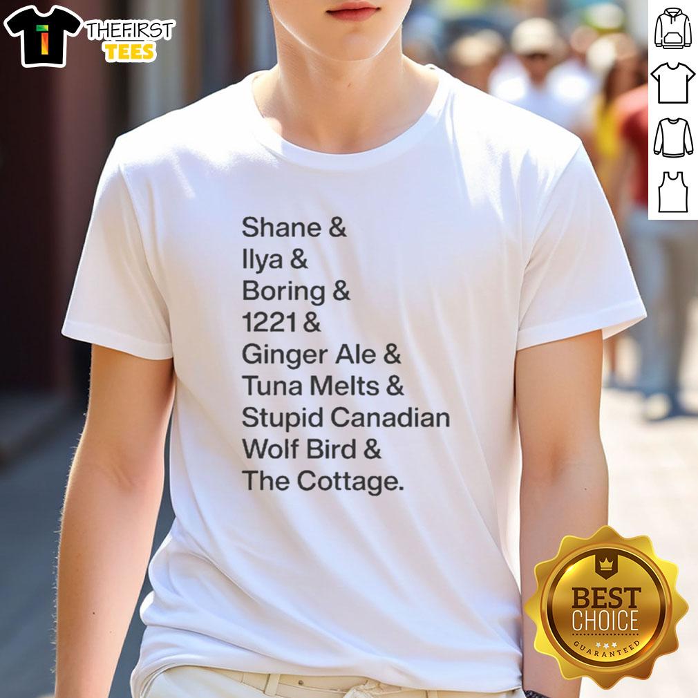 Premium T-shirt featuring Shane & Ilya's 'Boring 1221 Ginger Ale' design with a Canadian wolf bird at The Cottage.