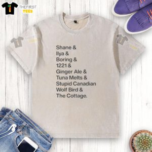 Alt Text: Premium Shane Ilya Boring ginger ale t-shirt featuring a whimsical Canadian wolf bird design, perfect for cottage wear.