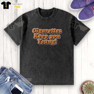 Stylish washed t-shirt featuring 'Pretty Cigarettes Keep You Young' slogan, perfect for casual fashion enthusiasts.