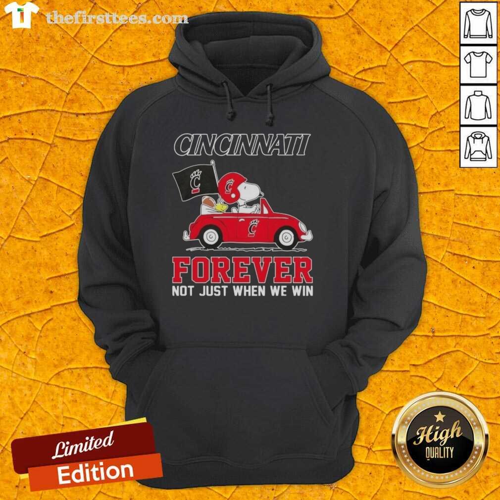 Alt Text: Snoopy driving a car wearing a Cincinnati Bearcats hoodie, showcasing 'Forever, Not Just When We Win' slogan.