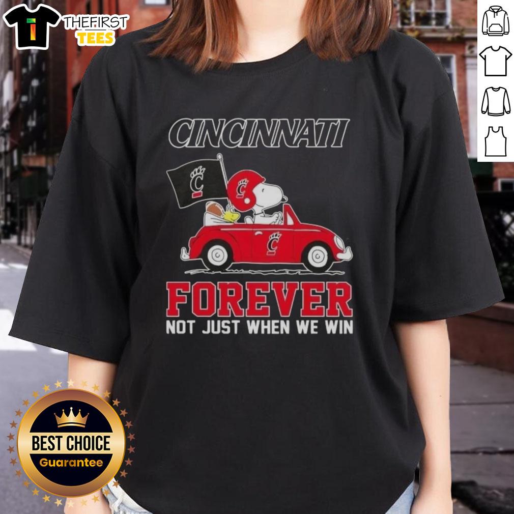 Pretty Peanuts Snoopy driving a car in a Cincinnati Bearcats Forever tee, celebrating fandom beyond just winning.