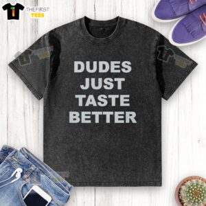 Top Dudes Just Taste Better washed t-shirt displayed on a wooden background, showcasing its trendy design and soft fabric.