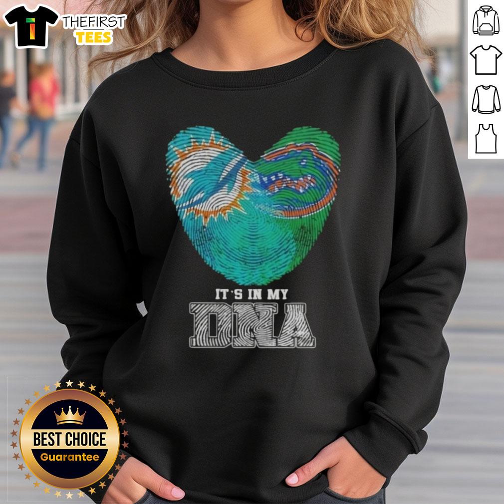 Miami Dolphins and Florida Gators sweatshirt featuring 'It's In My DNA' design, perfect for sports fans and alumni.
