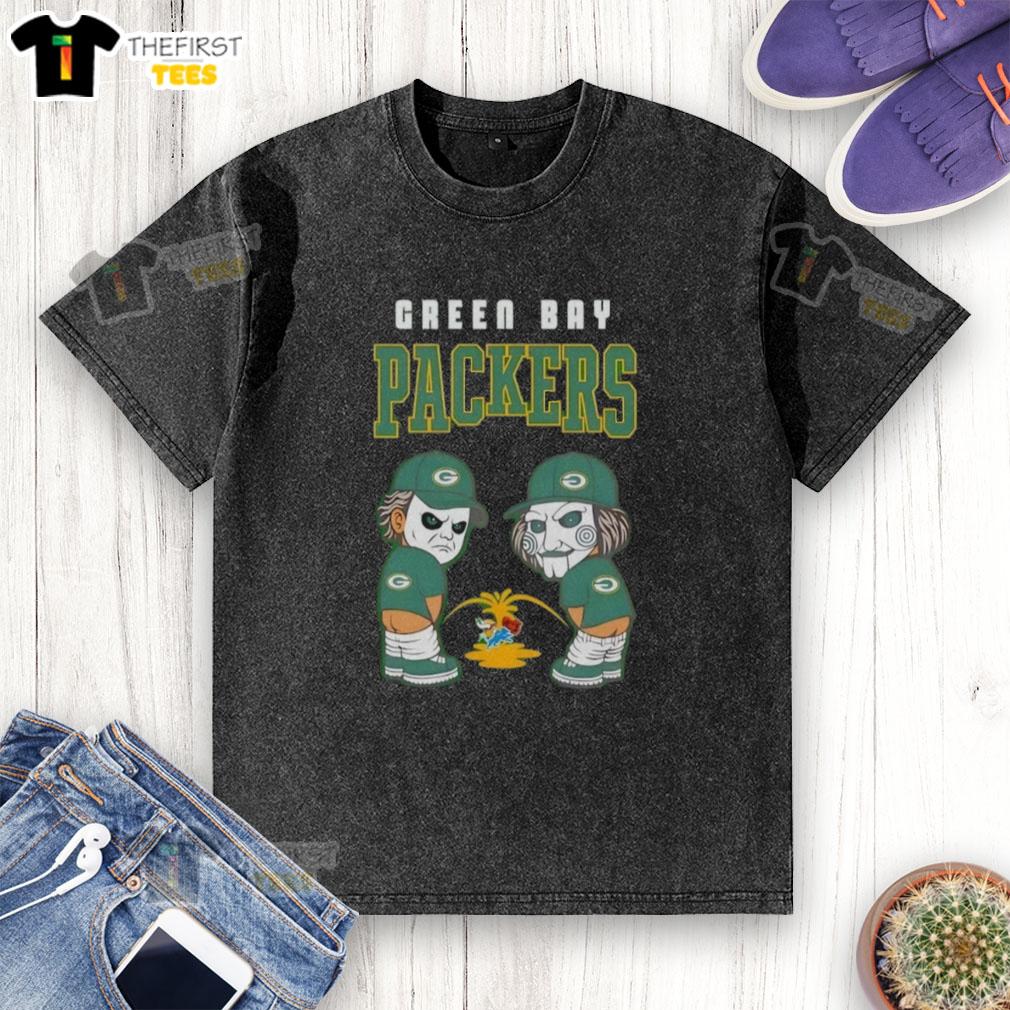 Alt Text: Top Green Bay Packers X Michael Myers and Billy the Puppet graphic on a washed t-shirt, perfect for fans and horror lovers.