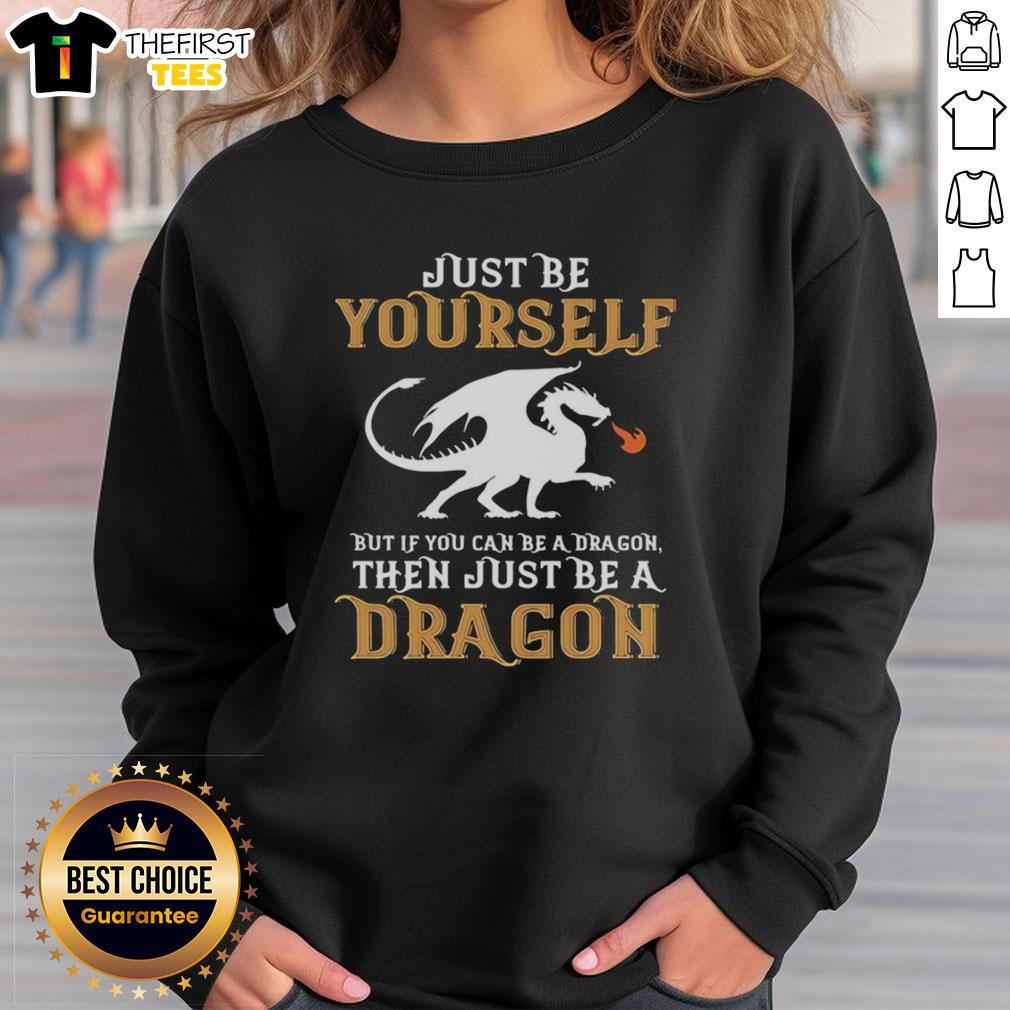 Cozy sweatshirt featuring 'Just Be Yourself, But If You Can Be A Dragon, Be A Dragon' design for unique style lovers.