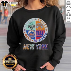 Alt Text: Top New York City Sports sweatshirt featuring logos of Liberty, Knicks, Giants, and Mets for fans.