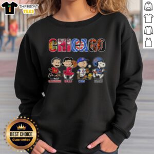 Cozy sweatshirt featuring Snoopy and Charlie Brown with Chicago Blackhawks, Bulls, Cubs, and Bears logos.