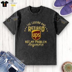 Alt Text: Top The Legend Has Retired washed t-shirt, featuring a humorous design, perfect for casual wear and fan apparel.