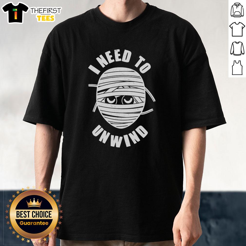 Alt Text: Funny Monster Mummy I Need To Unwind T-Shirt featuring a playful monster design perfect for relaxed Halloween vibes.