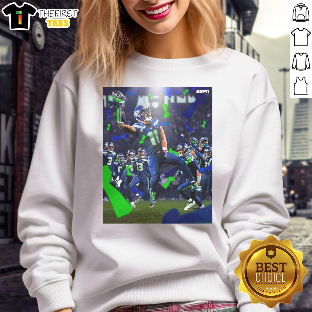 Jaxon Smith-Njigba celebrates with Seattle Seahawks Super Bowl LX Champions 2026 sweatshirt in vibrant colors.