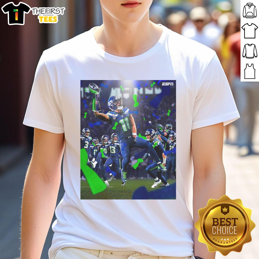 Alt Text: Jaxon Smith-Njigba wearing a Seattle Seahawks Super Bowl LX Champions 2026 victory t-shirt, celebrating the win.