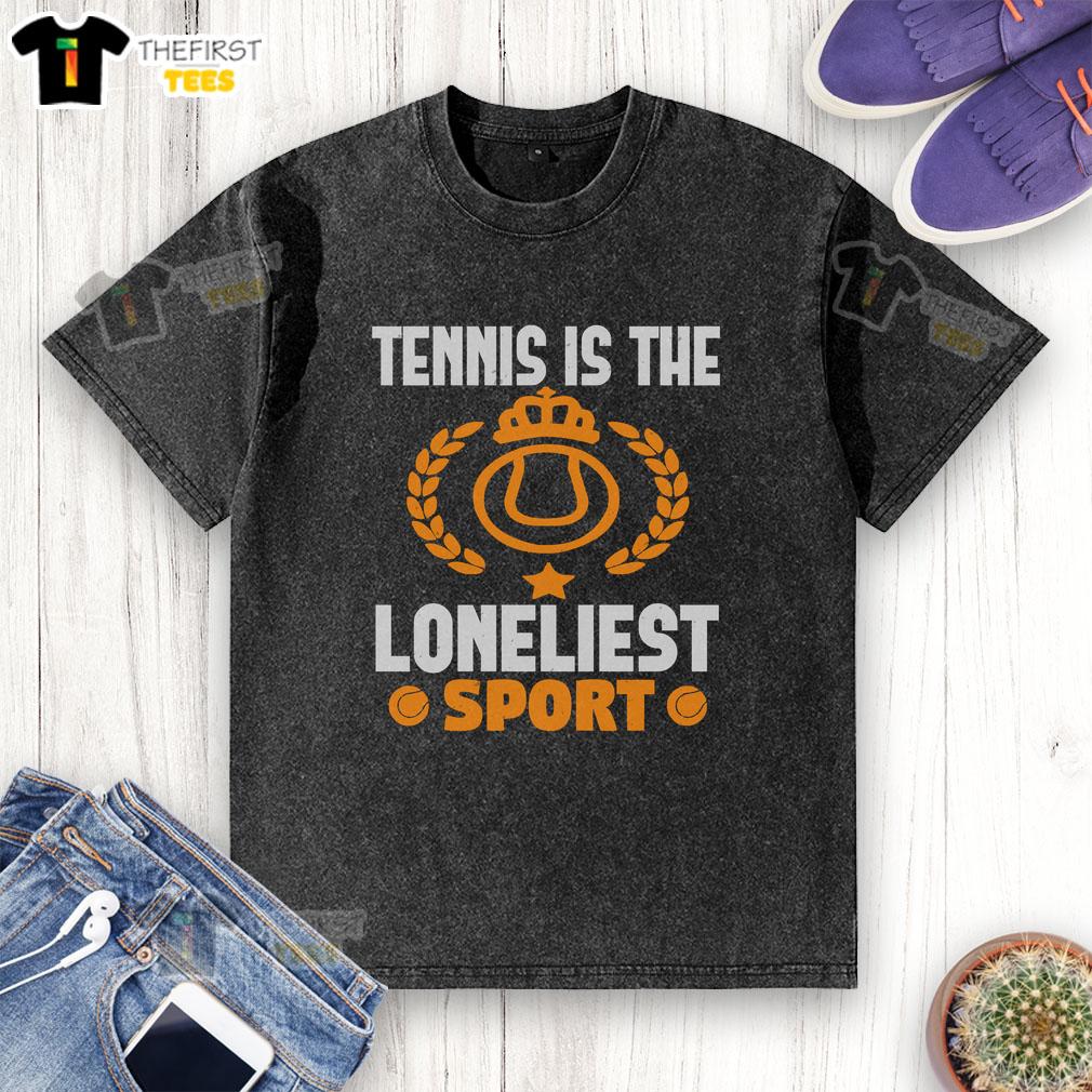 Official Tennis Is The Loneliest Sport washed t-shirt displayed on a wooden background, showcasing its unique design.