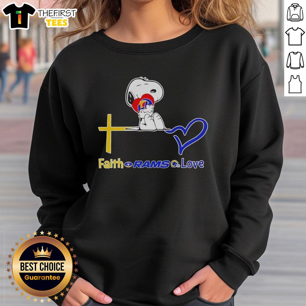 Premium Los Angeles Rams Snoopy hugs heart design on a cozy sweatshirt, perfect for Rams fans showcasing their love.