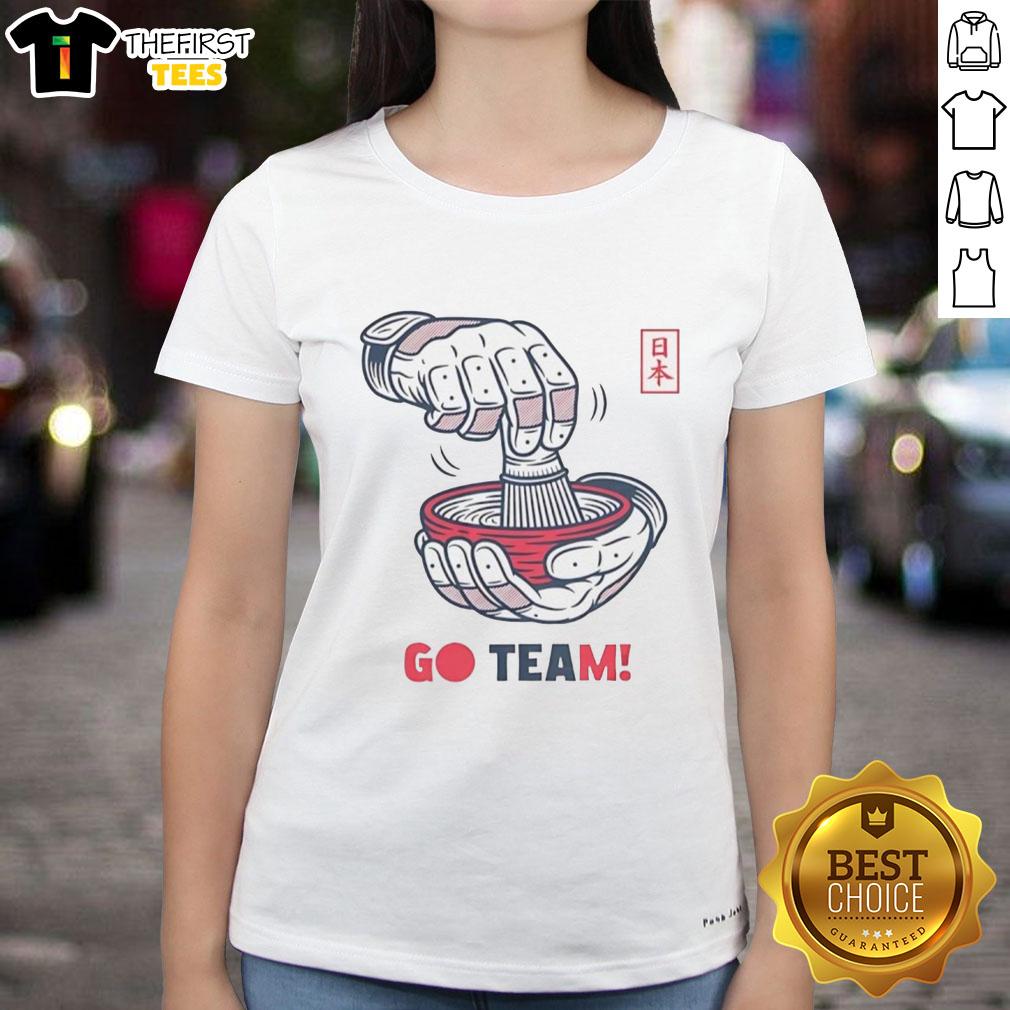 Ladies celebrating with tea in Japan, wearing Awesome Go Team Japan tees, showcasing culture and team spirit.