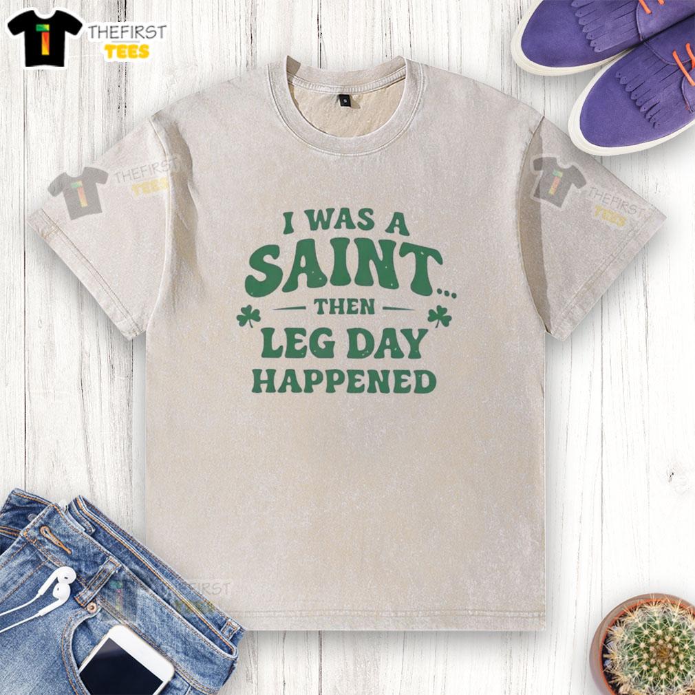 Funny 'I Was A Saint Then Leg Day Happened' St. Patrick's Day washed t-shirt showcasing humor and fitness theme.