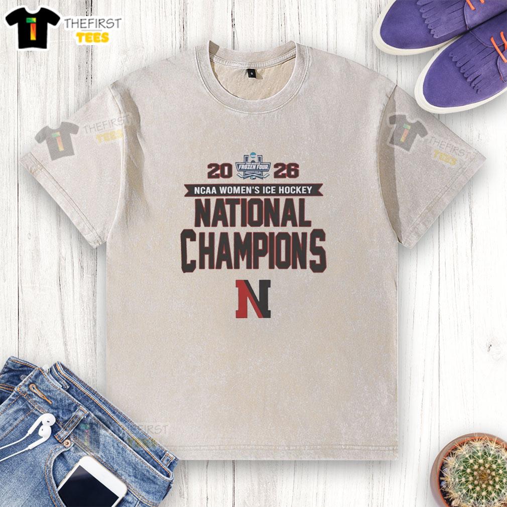 Alt Text: Northeastern Huskies NCAA Women's Ice Hockey Frozen Four Champions 2026 washed t-shirt featuring team logo and design.