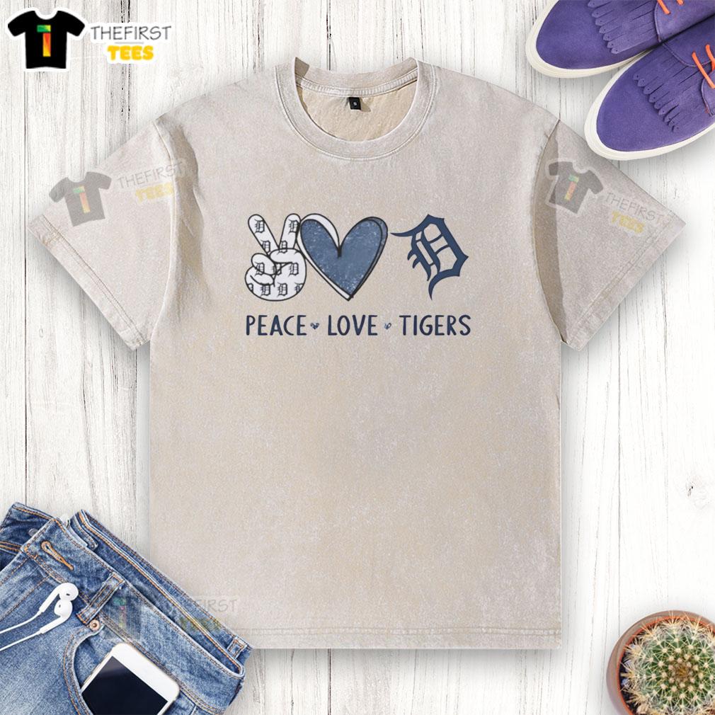 Pretty Detroit Tigers peace love hand sign heart logo on a washed t-shirt, perfect for baseball fans.