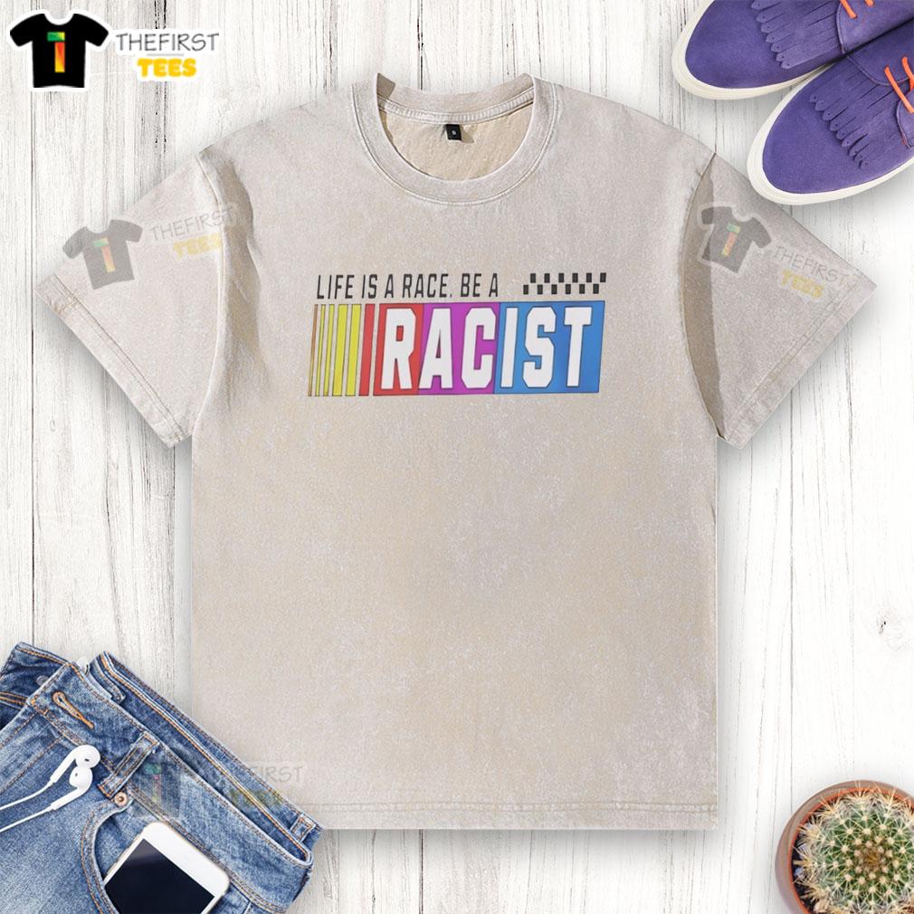 Top Life Is A Race Be A Racist washed t-shirt displayed on a hanger, promoting a bold statement on social issues.