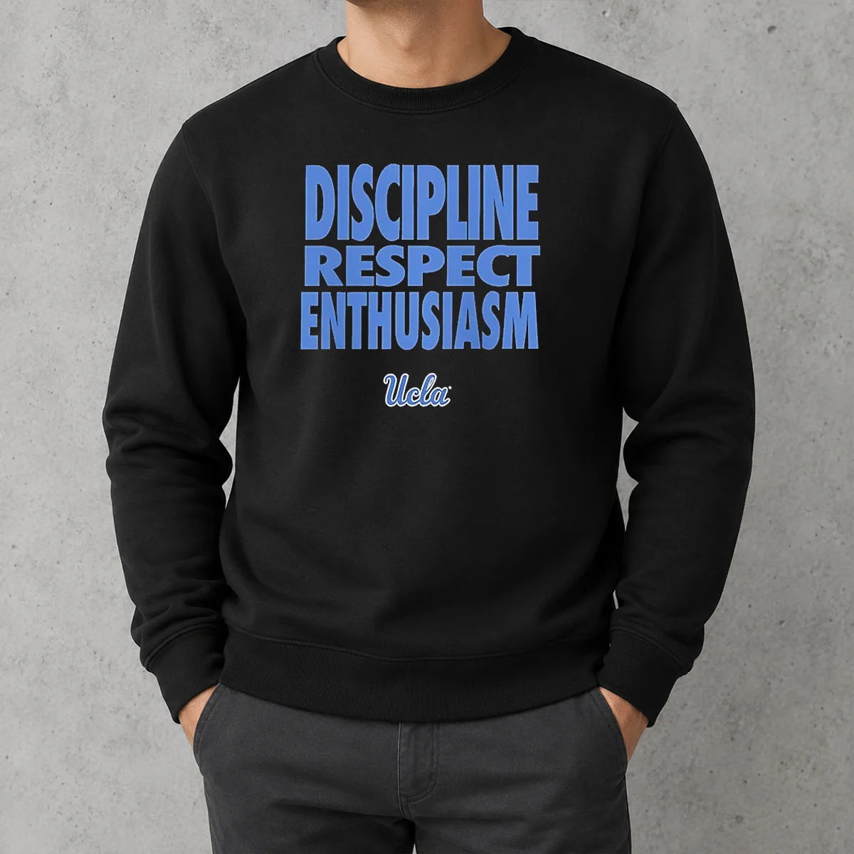 Official UCLA Bruins Discipline Respect Enthusiasm Sweater in navy blue with bold yellow lettering