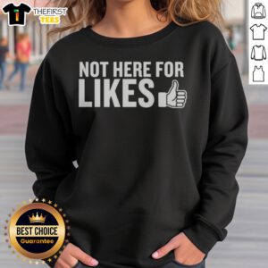 Top Not Here For Likes Sweatshirt displayed in a cozy indoor setting, perfect for casual wear.
