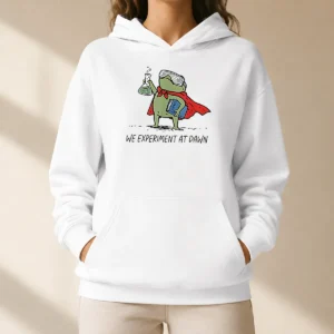 Awesome Science Frog We Experiment At Dawn Hoodie featuring a green frog graphic and bold text on a comfortable pullover hoodie