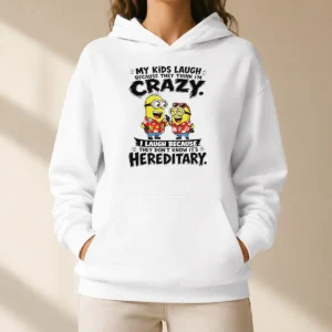 Funny Minion My Kids Laugh Because They Think Im Crazy I Laugh Because They Dont Know Its Heredi graphic on a black hoodie