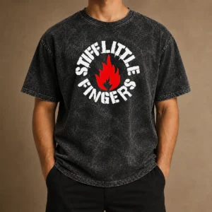 Pretty Stiff Little Fingers Circular Badge Logo With Flame Emblem Centered Inside on a washed cotton t shirt in a faded black color