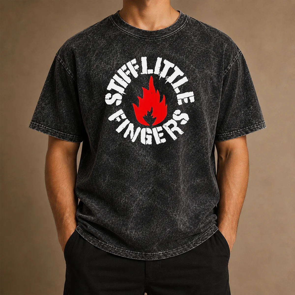 Pretty Stiff Little Fingers Circular Badge Logo With Flame Emblem Centered Inside on a washed cotton t shirt in a faded black color